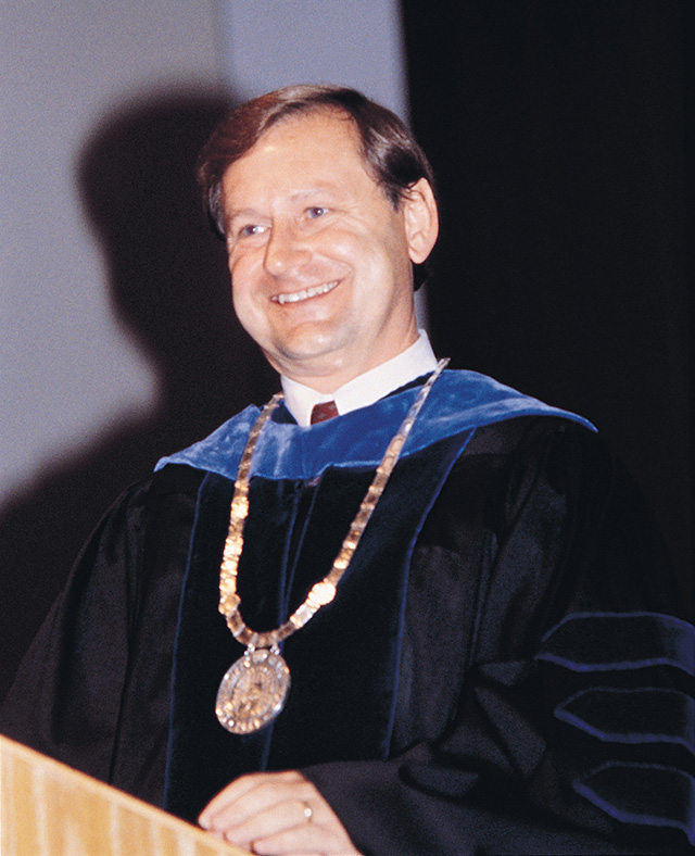 Vinson at podium during graduation.