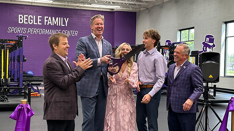 Everyone clapping after ribbon is cut