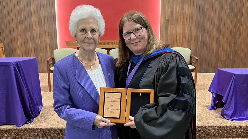 Price and Miller holding award