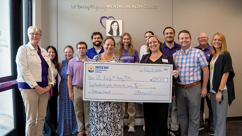 Group photo of everyone holding oversized United Way check