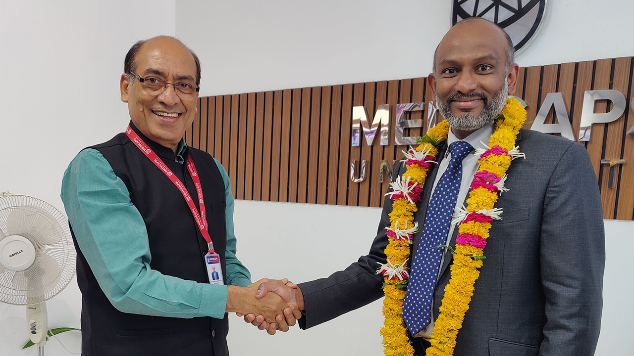 Dr. Suresh Immanuel shaking hands