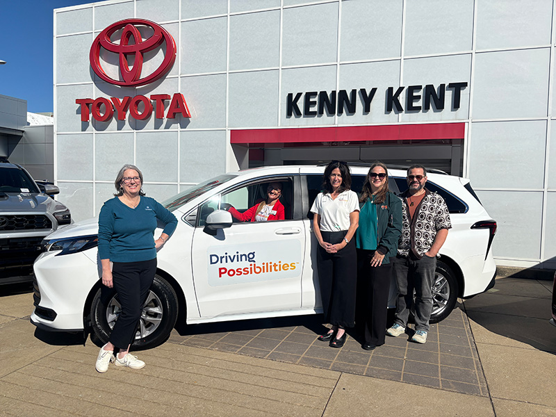 UE and Toyota representatives with new vehicle at Kenny Kent Toyota