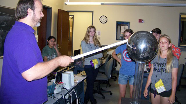 Teacher showing students Tesla ball