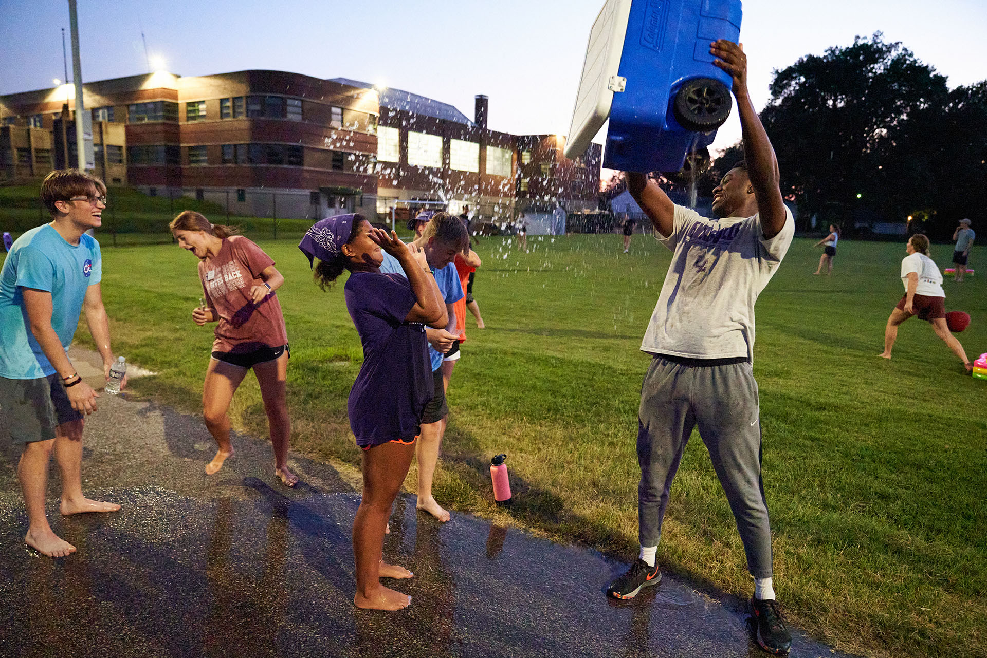 Welcome Week student dunking cooler out on others.
