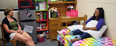 Students relaxing in dorm room (small)