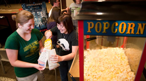 Students using a popcorn machine