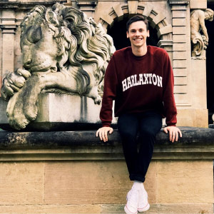 Andrew sitting on front of Harlaxton Manor