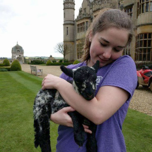 Sara at Harlaxton with baby lamb