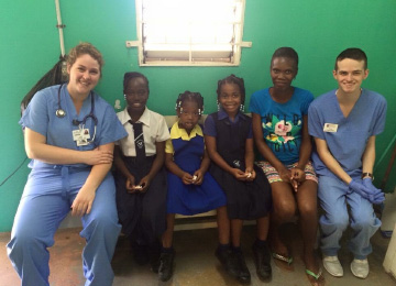 Haley with one of her fellow UE nursing students in Jamaica and some of their patients