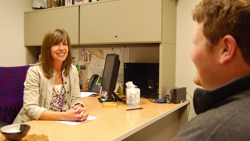 Counseling Services member with student in office