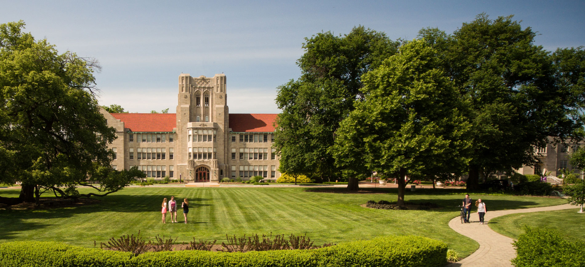 Campus front oval in summer with students