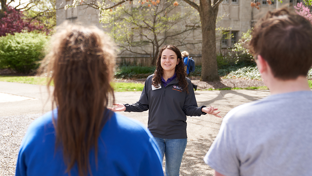 Student leads a tour outside