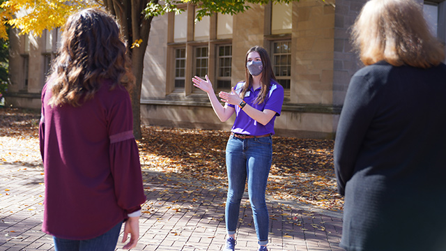 Visit counselor giving tour in Fall