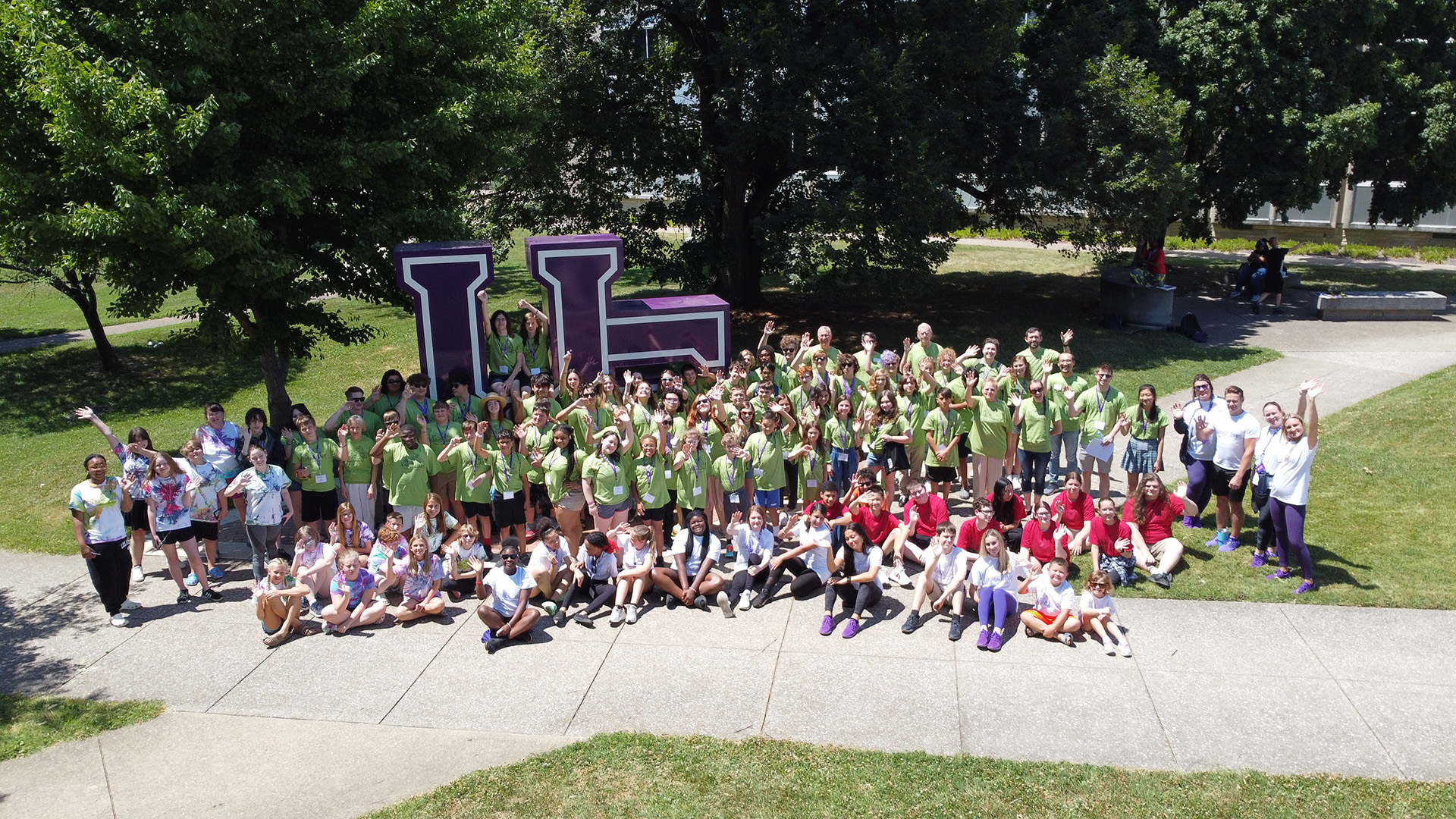 UE Summer Camps 2022 group shot UE Sign